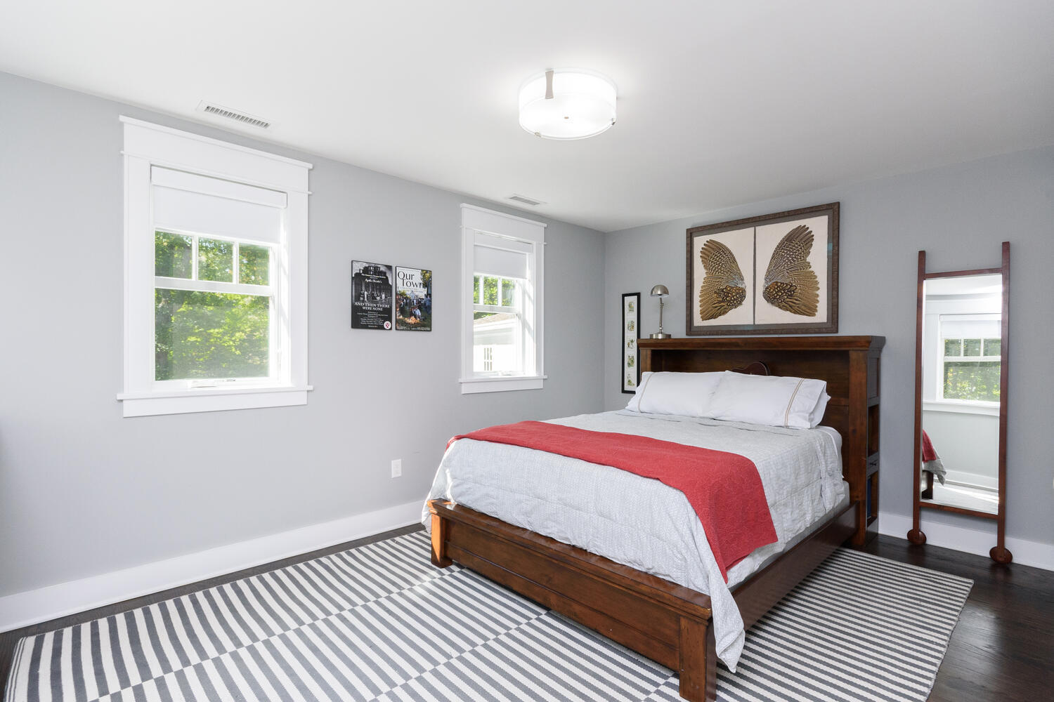 293 Hollow Tree Ridge Road Darien, CT 06820 - Photo 28 of 46 a bedroom with a bed lamp and a window