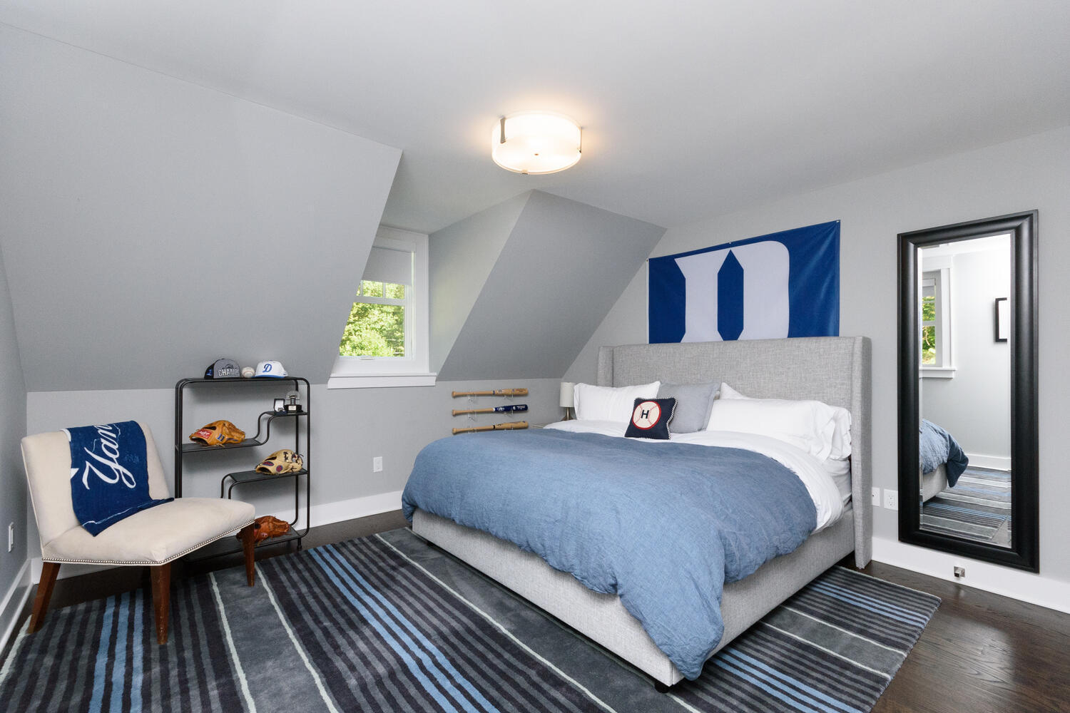 293 Hollow Tree Ridge Road Darien, CT 06820 - Photo 29 of 46 a bedroom with a bed and wooden floor