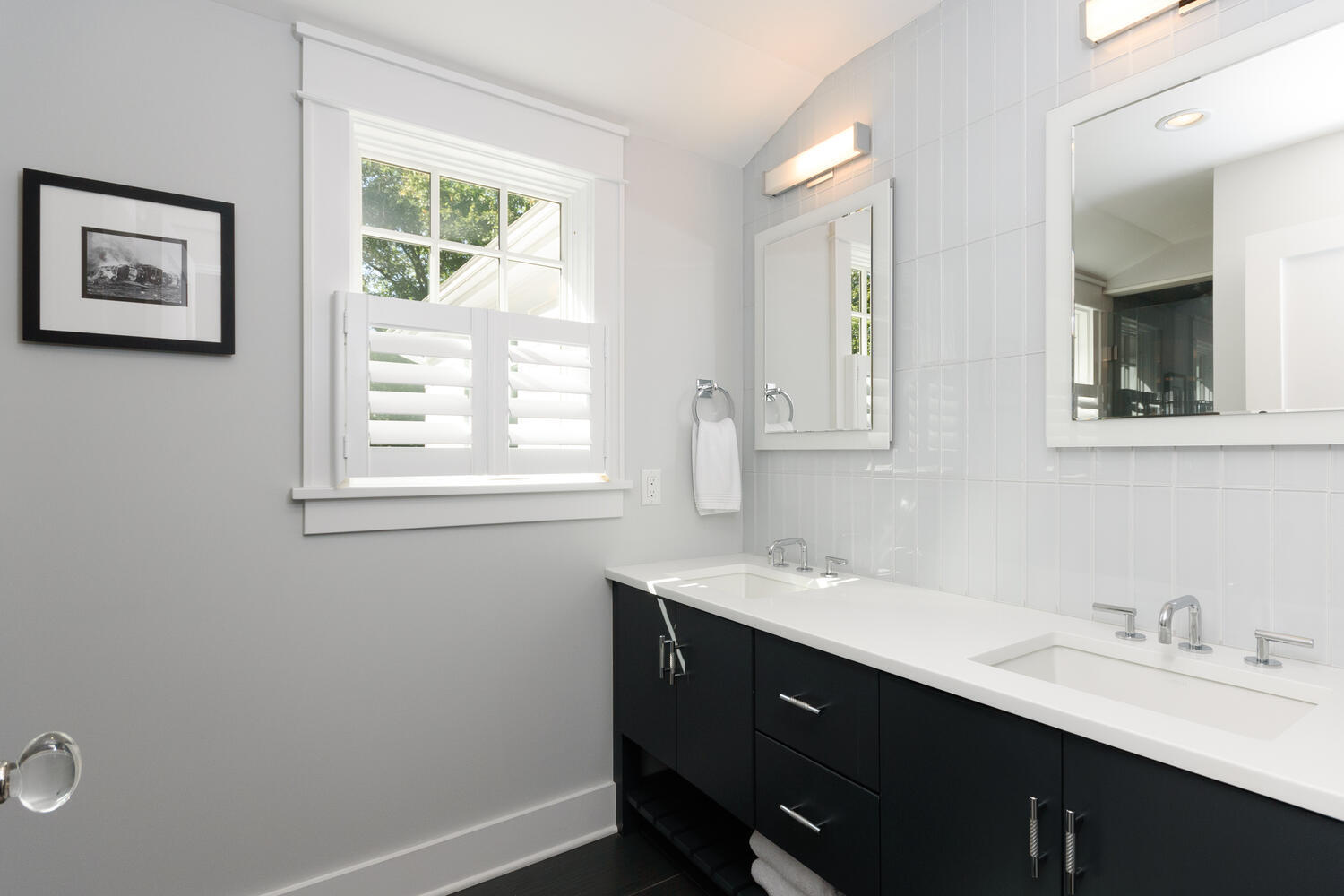 293 Hollow Tree Ridge Road Darien, CT 06820 - Photo 30 of 46 a bathroom with a sink a vanity and a window