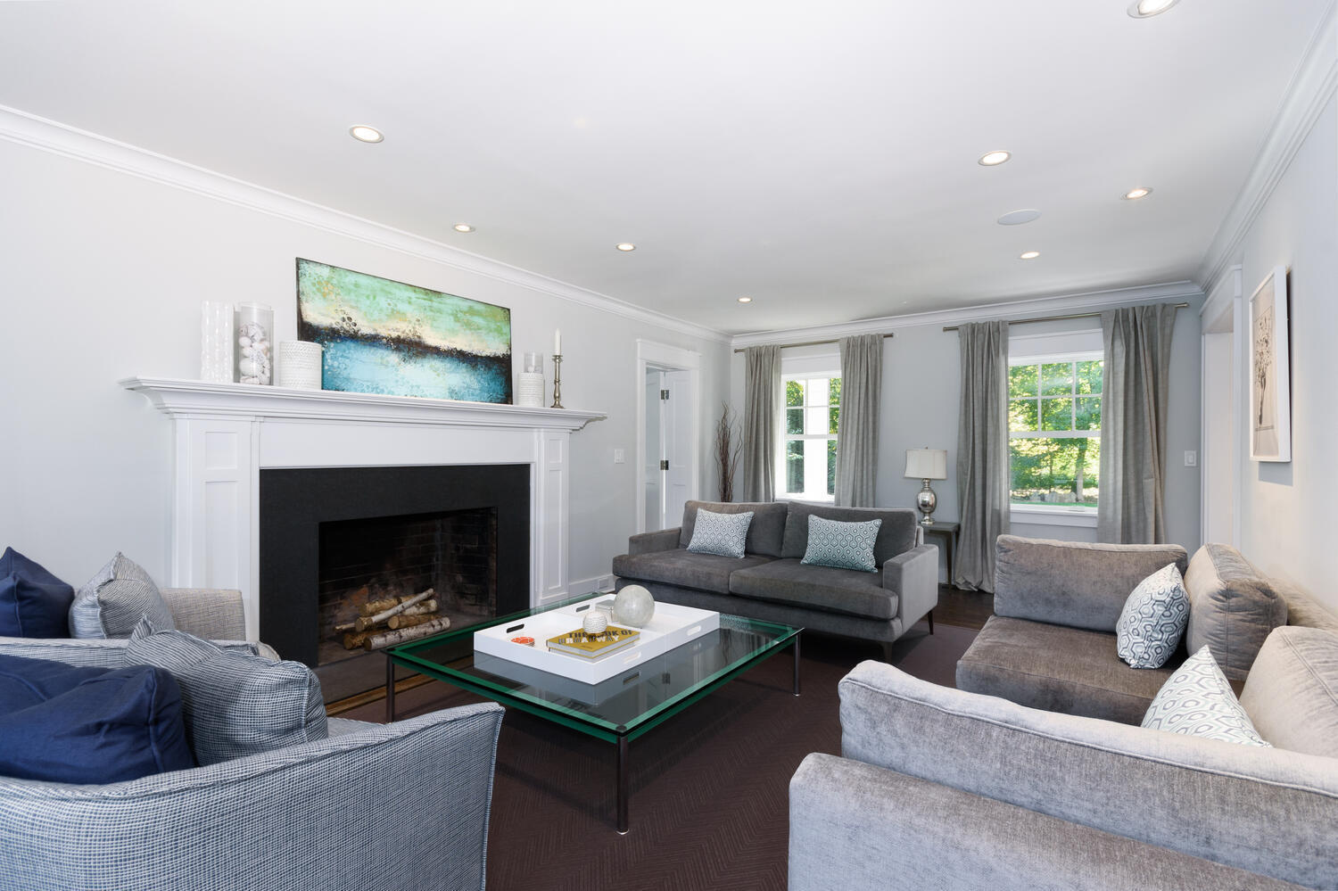 293 Hollow Tree Ridge Road Darien, CT 06820 - Photo 8 of 46 a living room with furniture and a fireplace