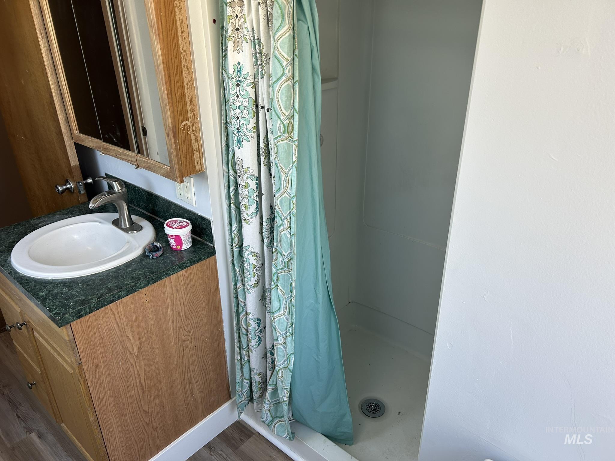 3837 16th Street Lewiston, ID 83501 - Photo 13 of 42 Bathroom featuring a stall shower and vanity