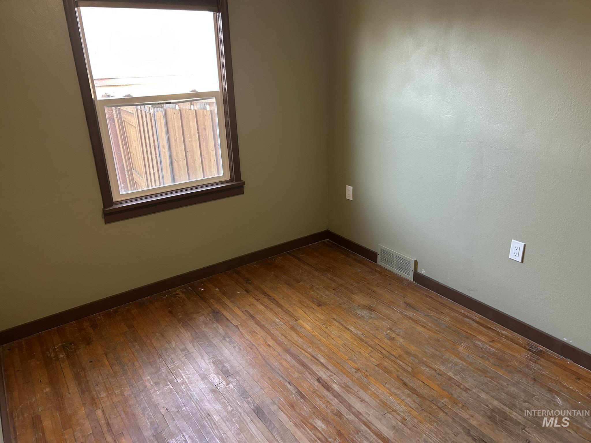 3837 16th Street Lewiston, ID 83501 - Photo 13 of 45 Unfurnished room with dark wood-type flooring and baseboards