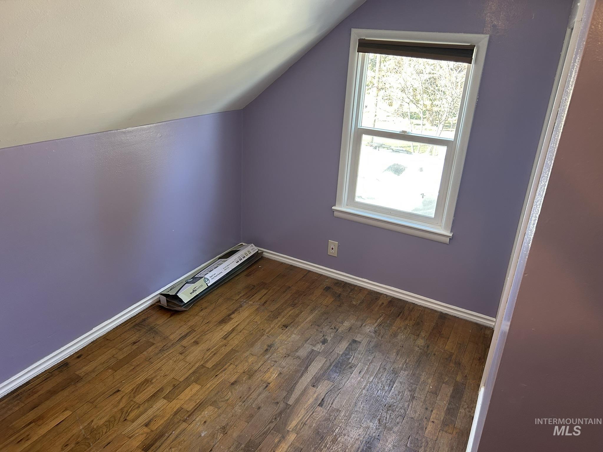 3837 16th Street Lewiston, ID 83501 - Photo 15 of 42 Additional living space with lofted ceiling and dark wood-type flooring