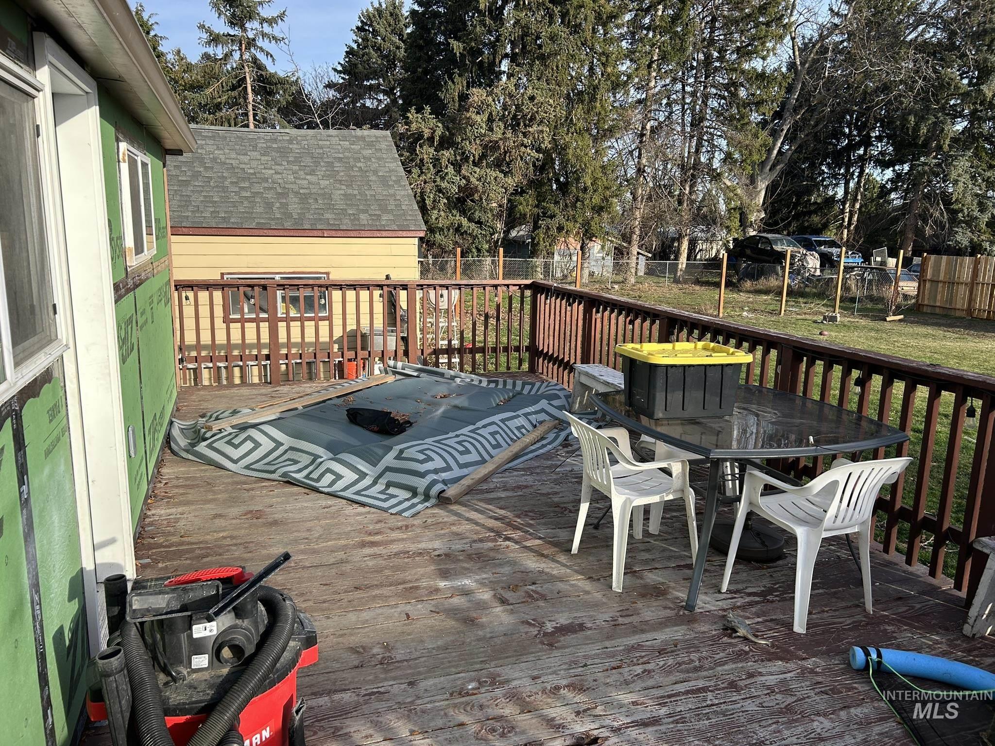 3837 16th Street Lewiston, ID 83501 - Photo 22 of 45 Wooden terrace with outdoor dining space and a fenced backyard