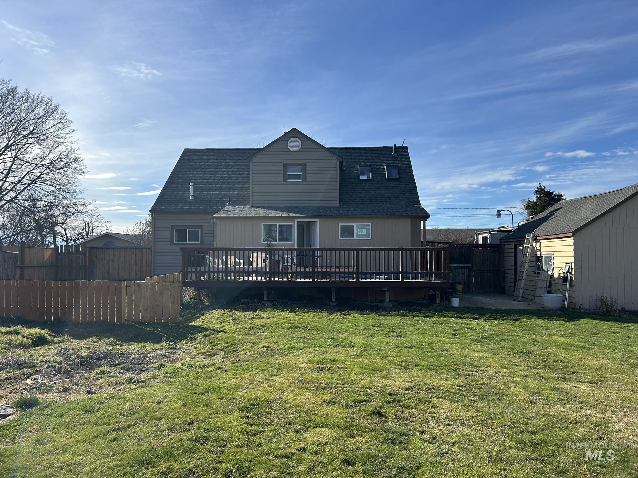 3837 16th Street Lewiston, ID 83501 - Photo 26 of 42 Rear view of property featuring roof with shingles and a wooden deck
