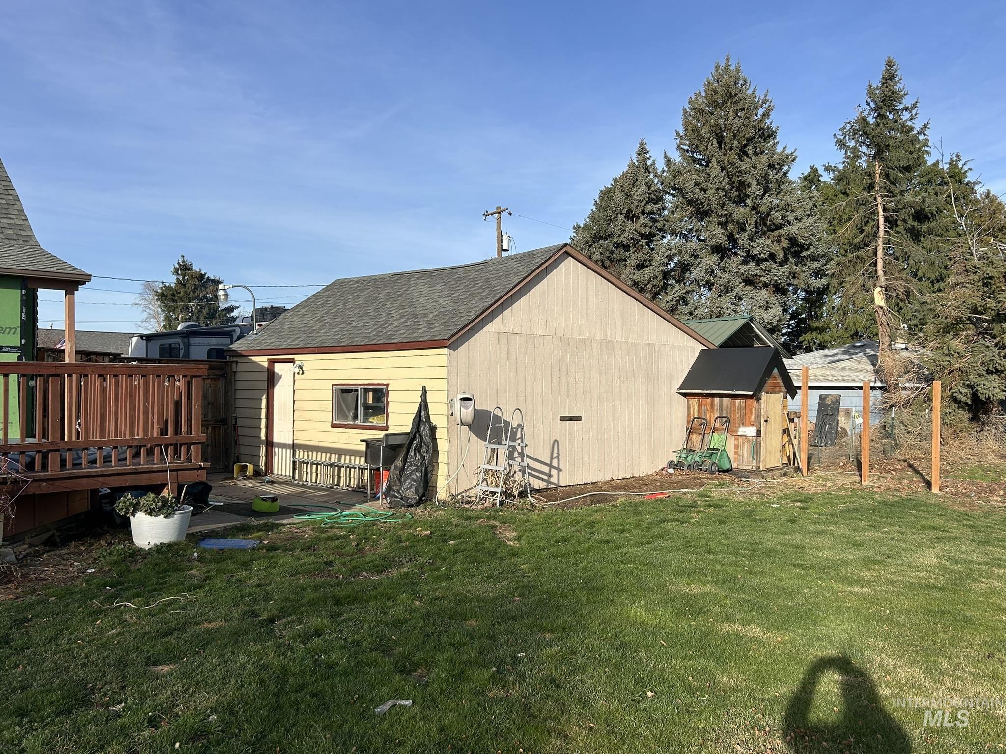3837 16th Street Lewiston, ID 83501 - Photo 33 of 42 Rear view of house featuring a deck and roof with shingles