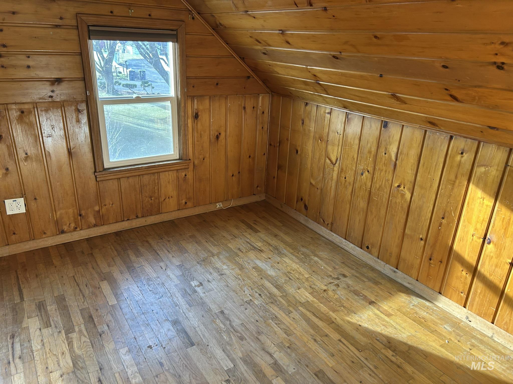 3837 16th Street Lewiston, ID 83501 - Photo 35 of 45 Additional living space with light wood-style floors, lofted ceiling, wood walls, and wooden ceiling