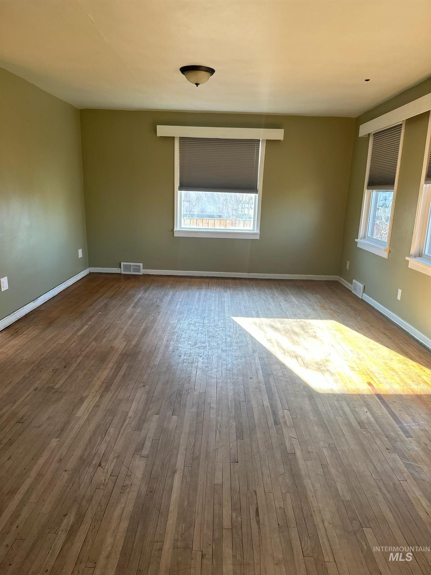 3837 16th Street Lewiston, ID 83501 - Photo 4 of 45 Spare room featuring plenty of natural light and wood-type flooring