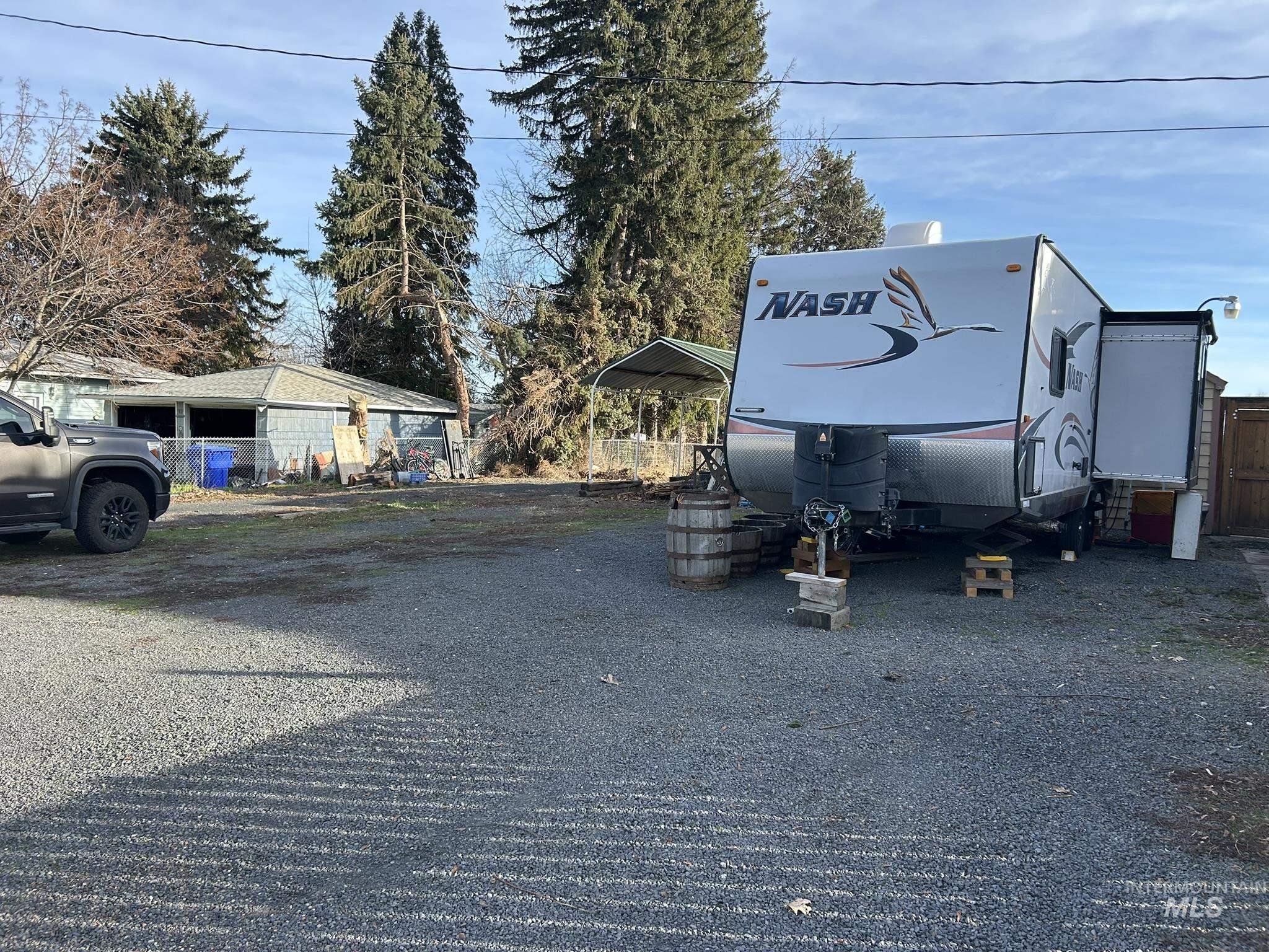 3837 16th Street Lewiston, ID 83501 - Photo 45 of 45 View of parking / parking lot featuring a detached carport
