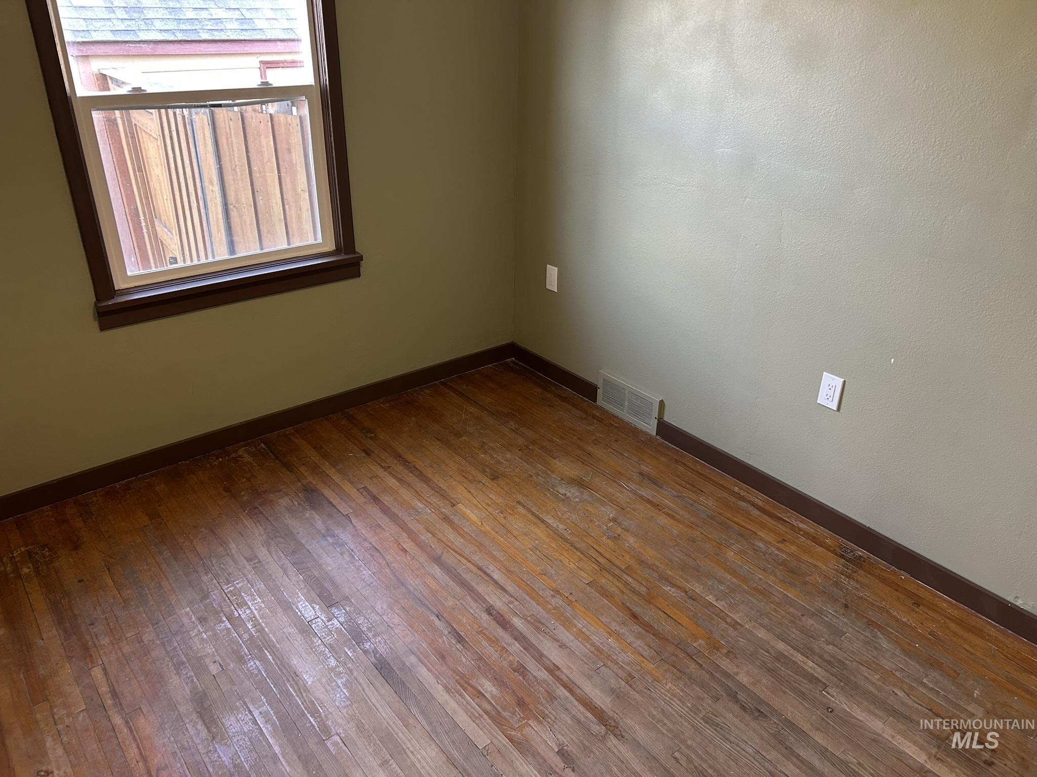 3837 16th Street Lewiston, ID 83501 - Photo 7 of 42 Spare room with hardwood / wood-style floors and baseboards