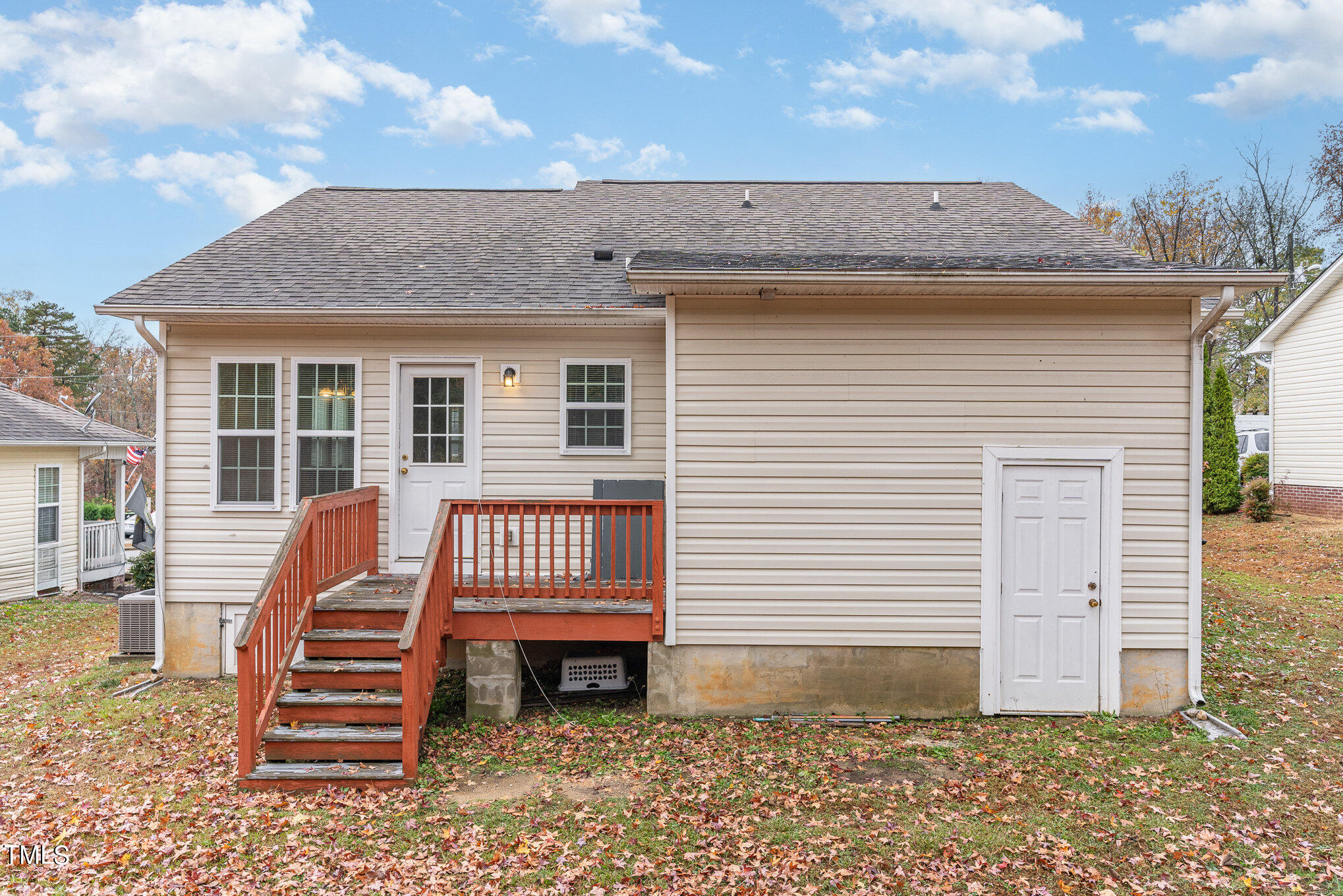 607 2nd Street Apex, NC 27502 - Photo 15 of 16 a view of a house with a wooden deck