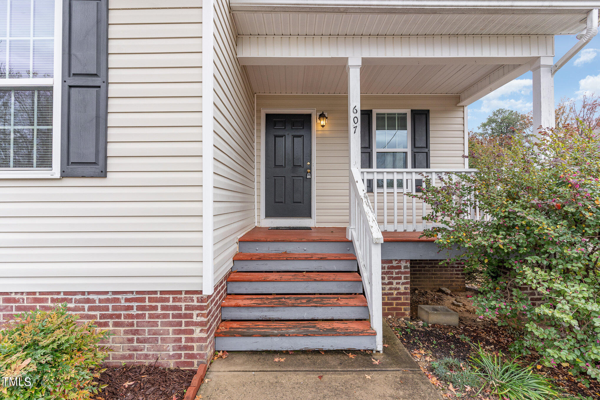 607 2nd Street Apex, NC 27502 - Photo 2 of 16 a front view of a house with a porch