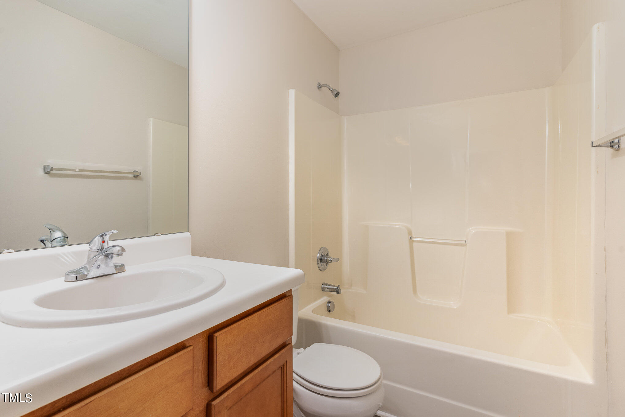 607 2nd Street Apex, NC 27502 - Photo 10 of 16 a bathroom with a sink toilet and shower