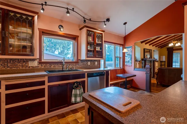 a kitchen with stainless steel appliances granite countertop a stove and a sink