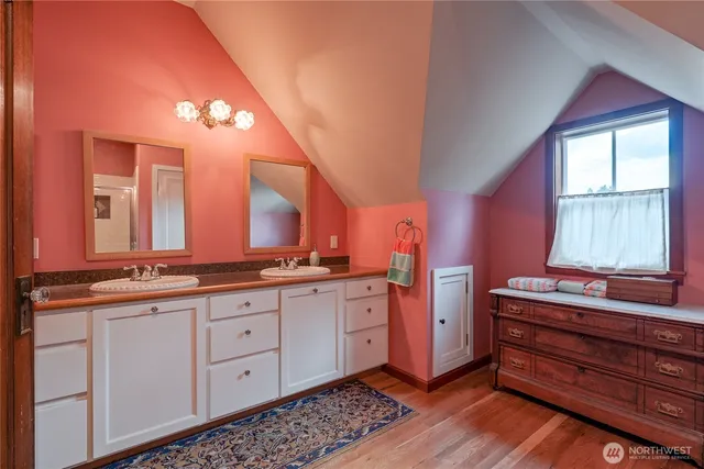 a view of room with window and hardwood floor