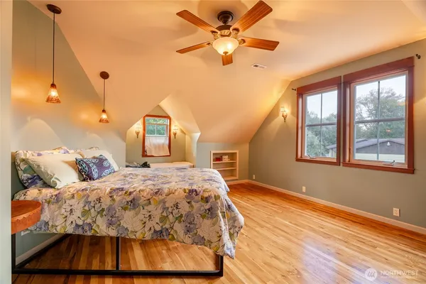 a view of a hallway with wooden shelves
