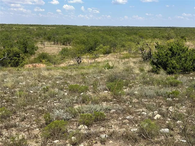 a view of lake with green space