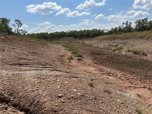 a view of lake with green space