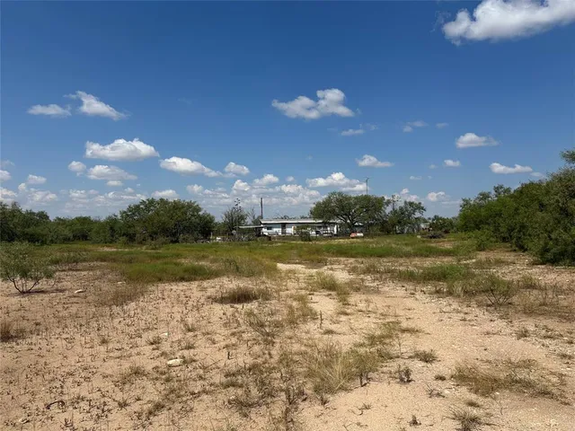 a view of a lake with green space