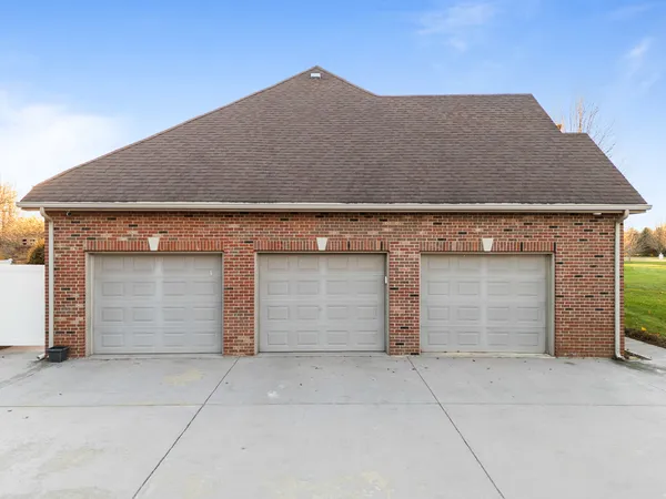 a kitchen with stainless steel appliances granite countertop a stove sink microwave and cabinets