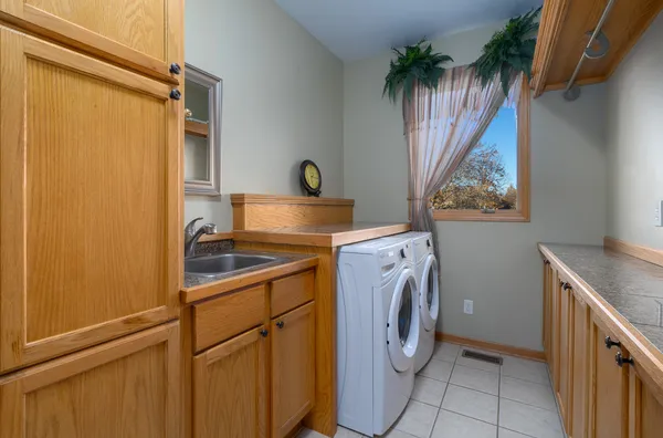 a view of a kitchen with a sink and cabinets