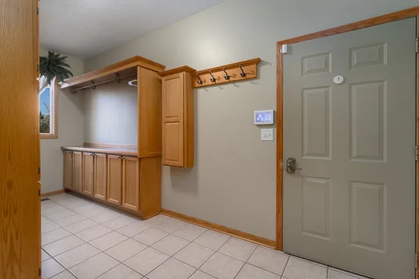 a bathroom with a sink a toilet a mirror and shower