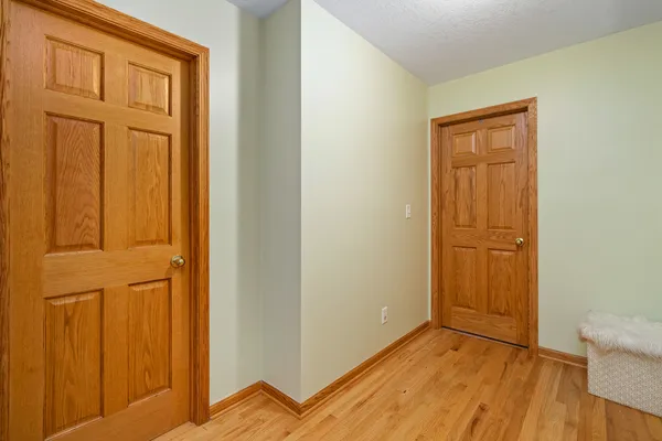 a bedroom with a bed and a night stand