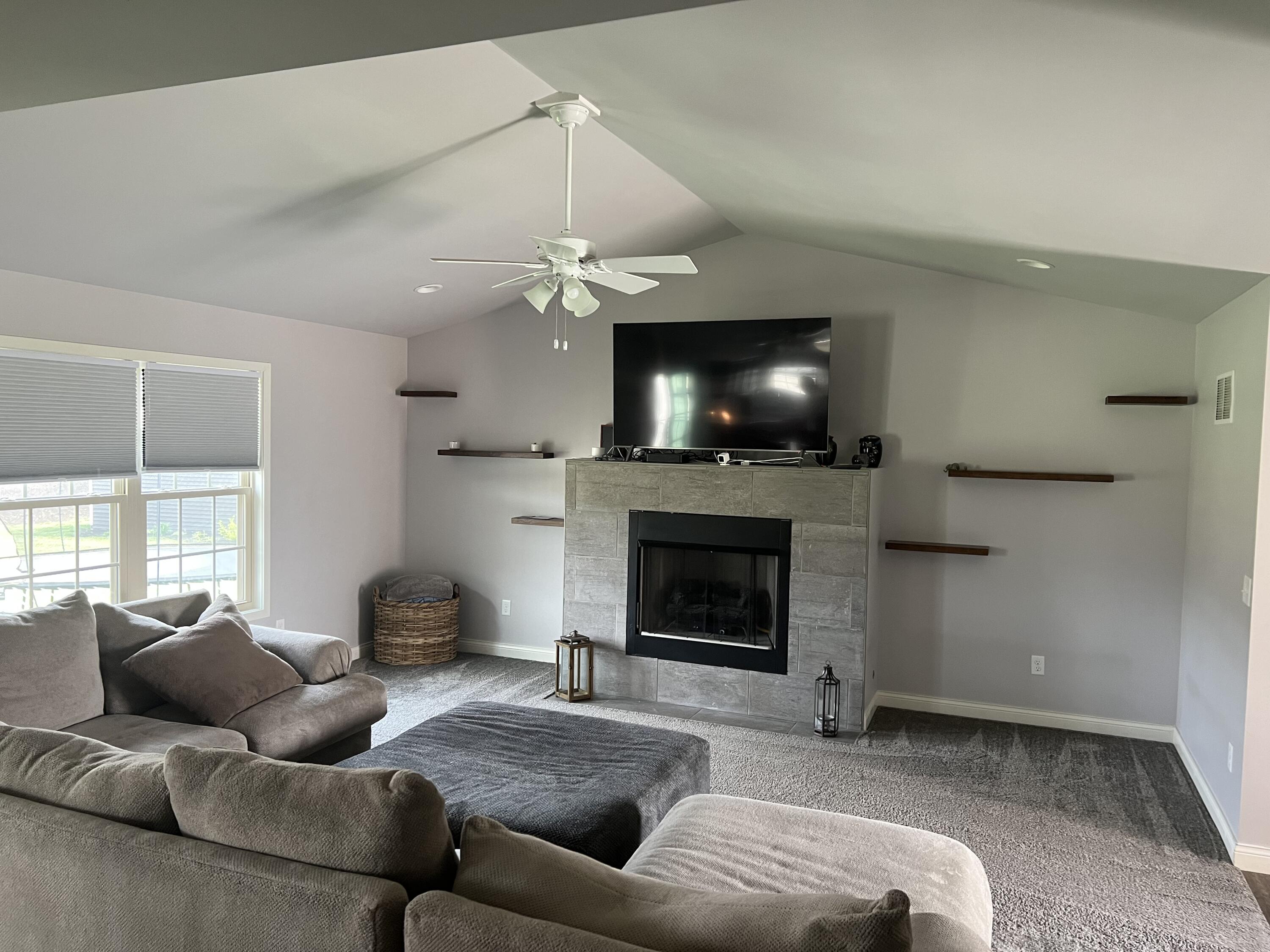 702 19th Street Southeast De Motte, IN 46310 - Photo 4 of 22 a living room with furniture and a fireplace