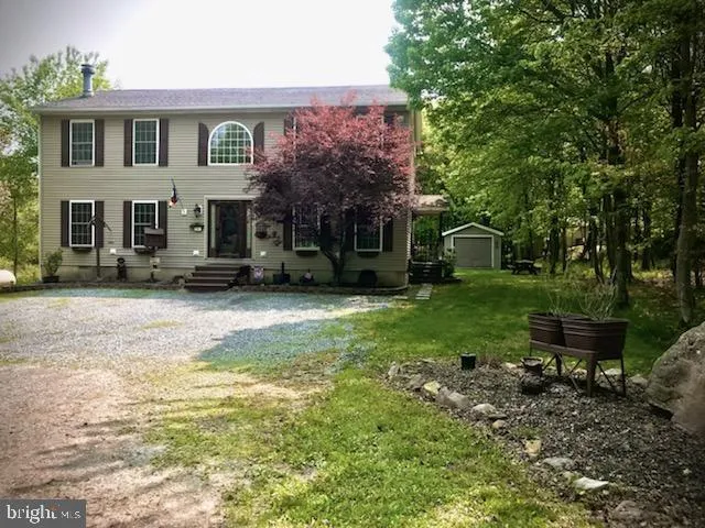 a view of a yard in front of a house
