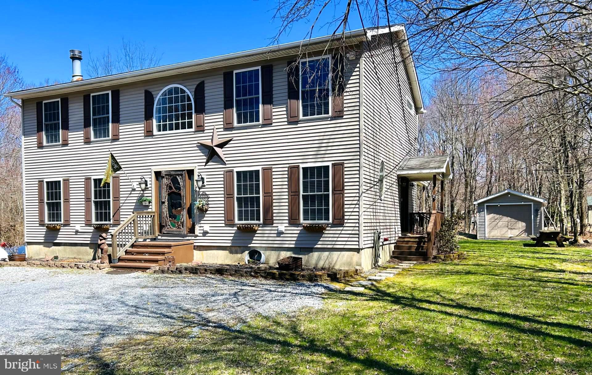 a front view of house with outdoor seating