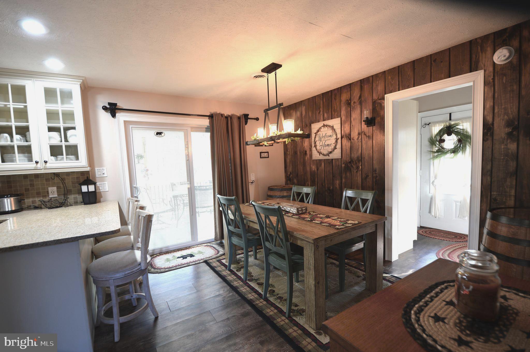 14 Minnie Ha-Ha Road Albrightsville, PA 18210 - Photo 14 of 34 a very nice looking dining room with a table and chairs