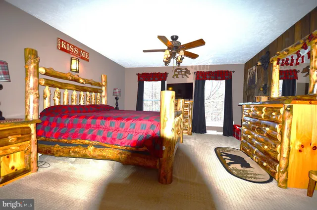 a bedroom with a bed and window