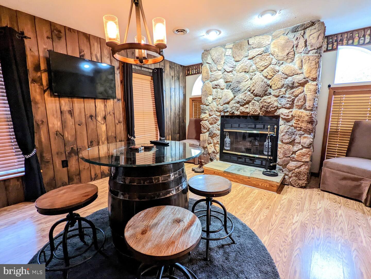 14 Minnie Ha-Ha Road Albrightsville, PA 18210 - Photo 7 of 34 a living room with furniture a flat screen tv and kitchen view