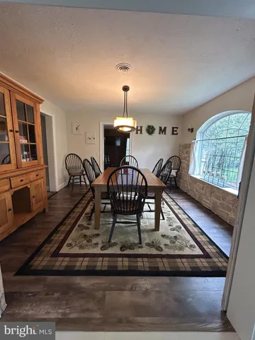 a view of a living room and a rug
