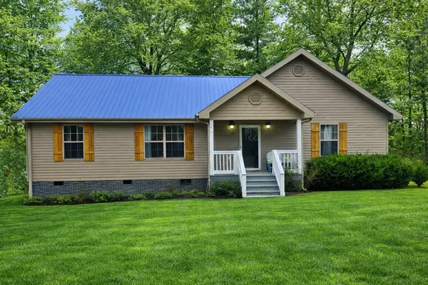 a front view of a house with a yard
