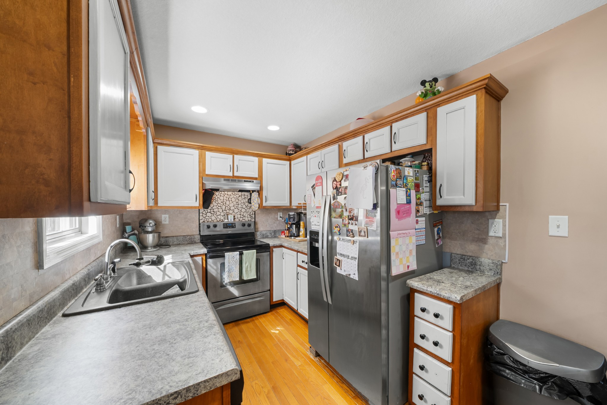 124 Brown Lane Tracy City, TN 37387 - Photo 13 of 28 a kitchen with stainless steel appliances granite countertop a refrigerator a stove and a sink with wooden floor