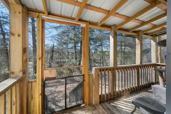 a view of a porch with wooden floor
