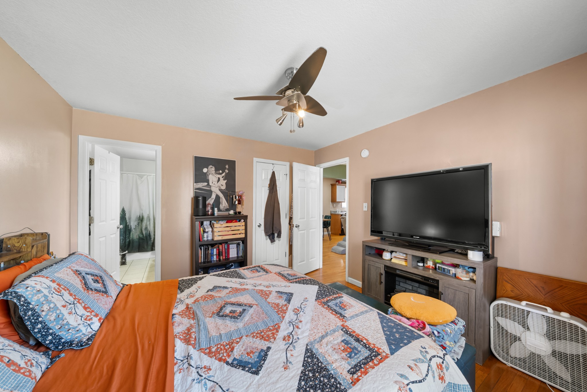 124 Brown Lane Tracy City, TN 37387 - Photo 19 of 28 a bedroom with a bed and a flat screen tv