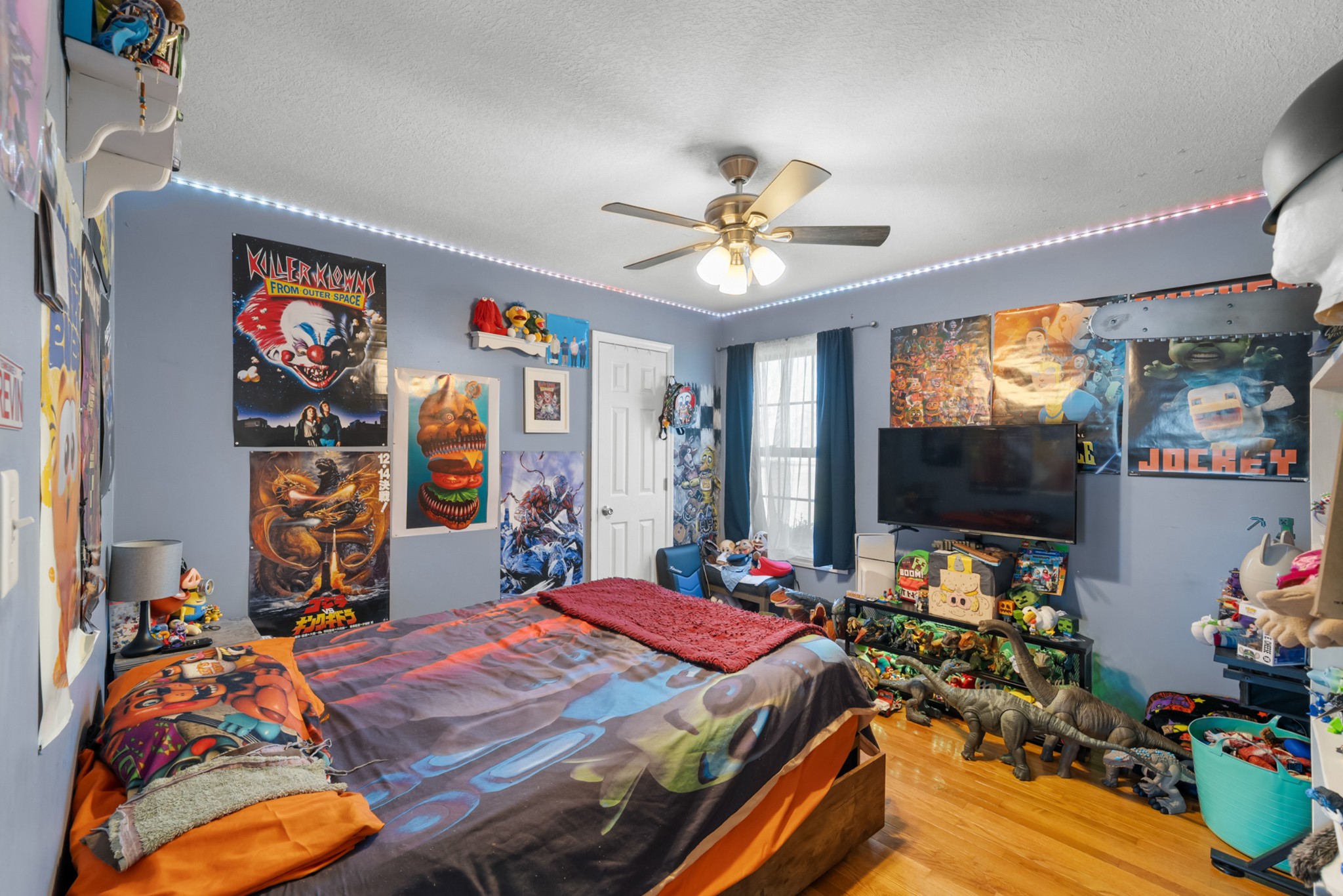 124 Brown Lane Tracy City, TN 37387 - Photo 21 of 28 a bedroom with a bed and a flat screen tv
