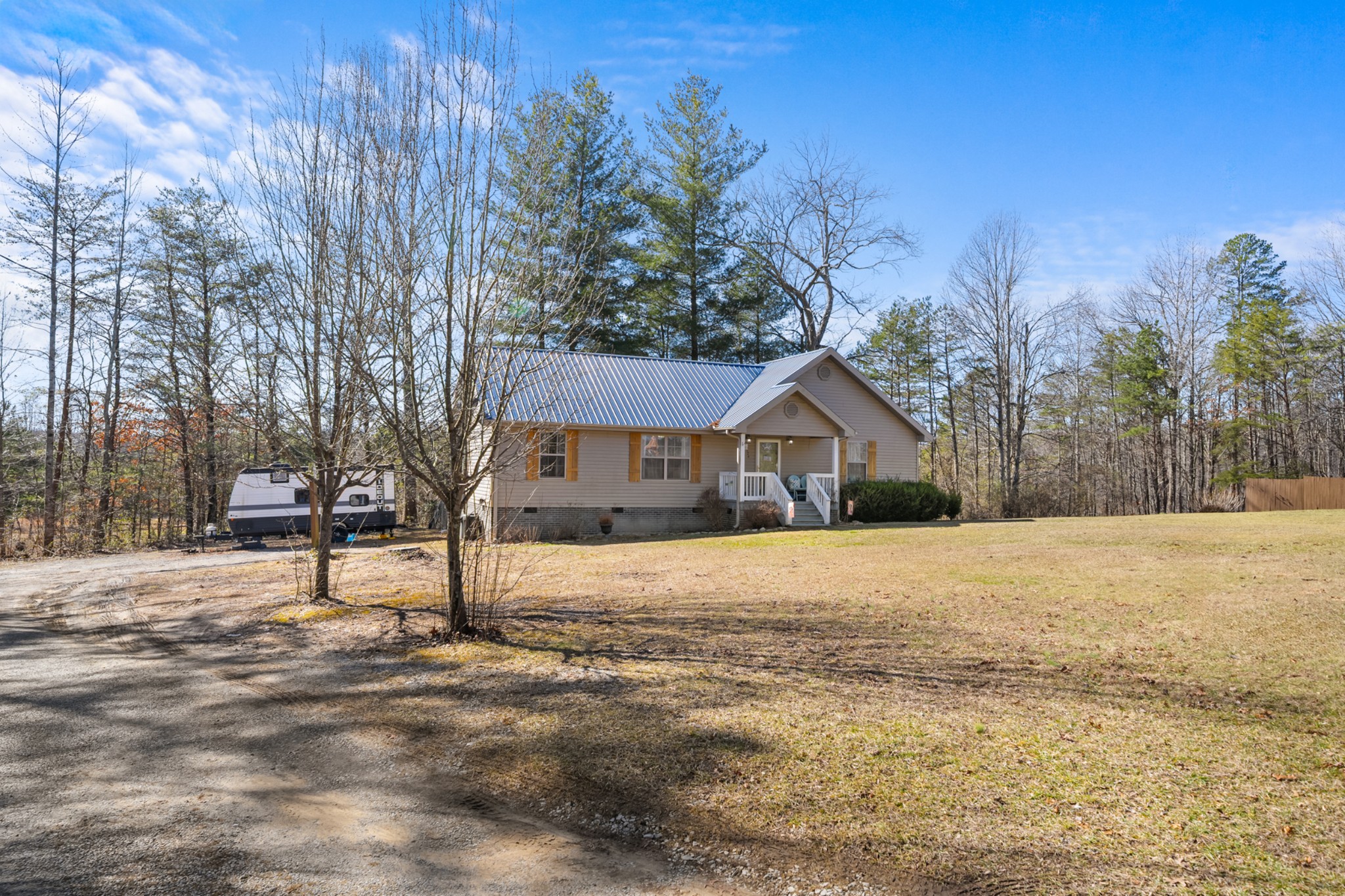 124 Brown Lane Tracy City, TN 37387 - Photo 24 of 28 a house with a yard