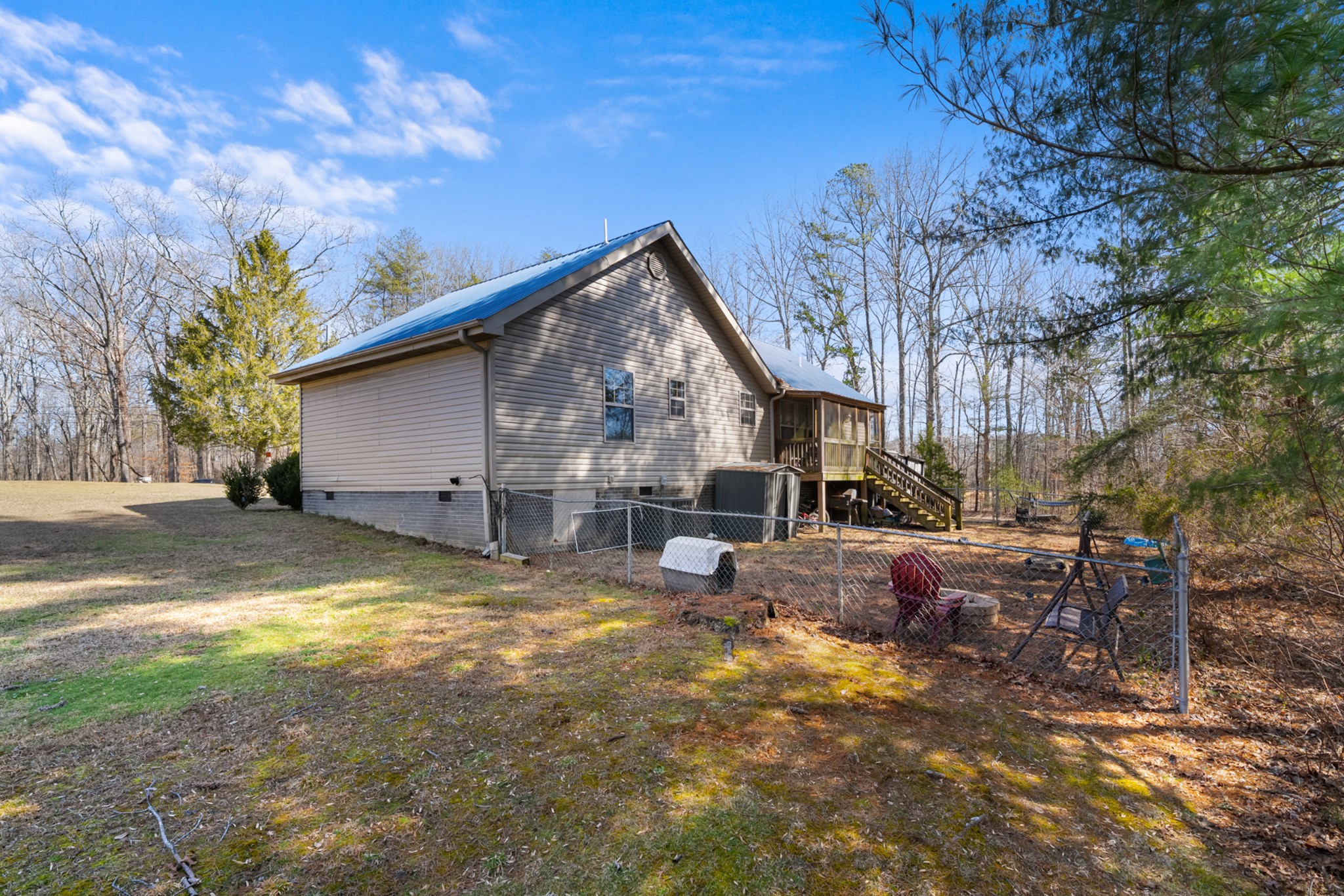 124 Brown Lane Tracy City, TN 37387 - Photo 27 of 28 a view of backyard of house with wooden deck and seating space