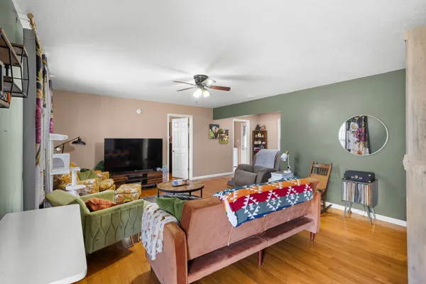 a bedroom with furniture and a flat screen tv