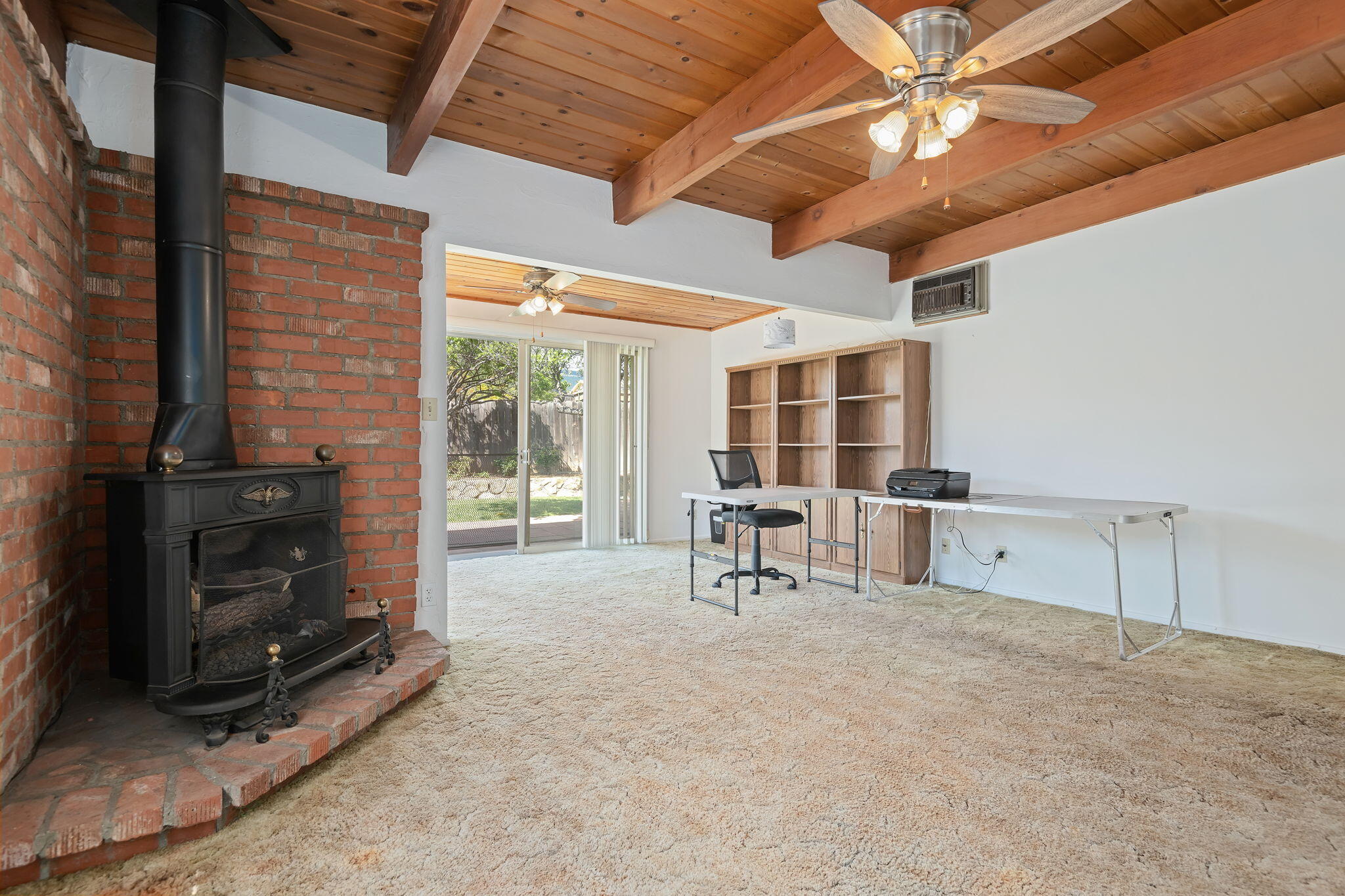 673 Rossmore Road Goleta, CA 93117 - Photo 17 of 25 a living room with furniture a flat screen tv and a fireplace