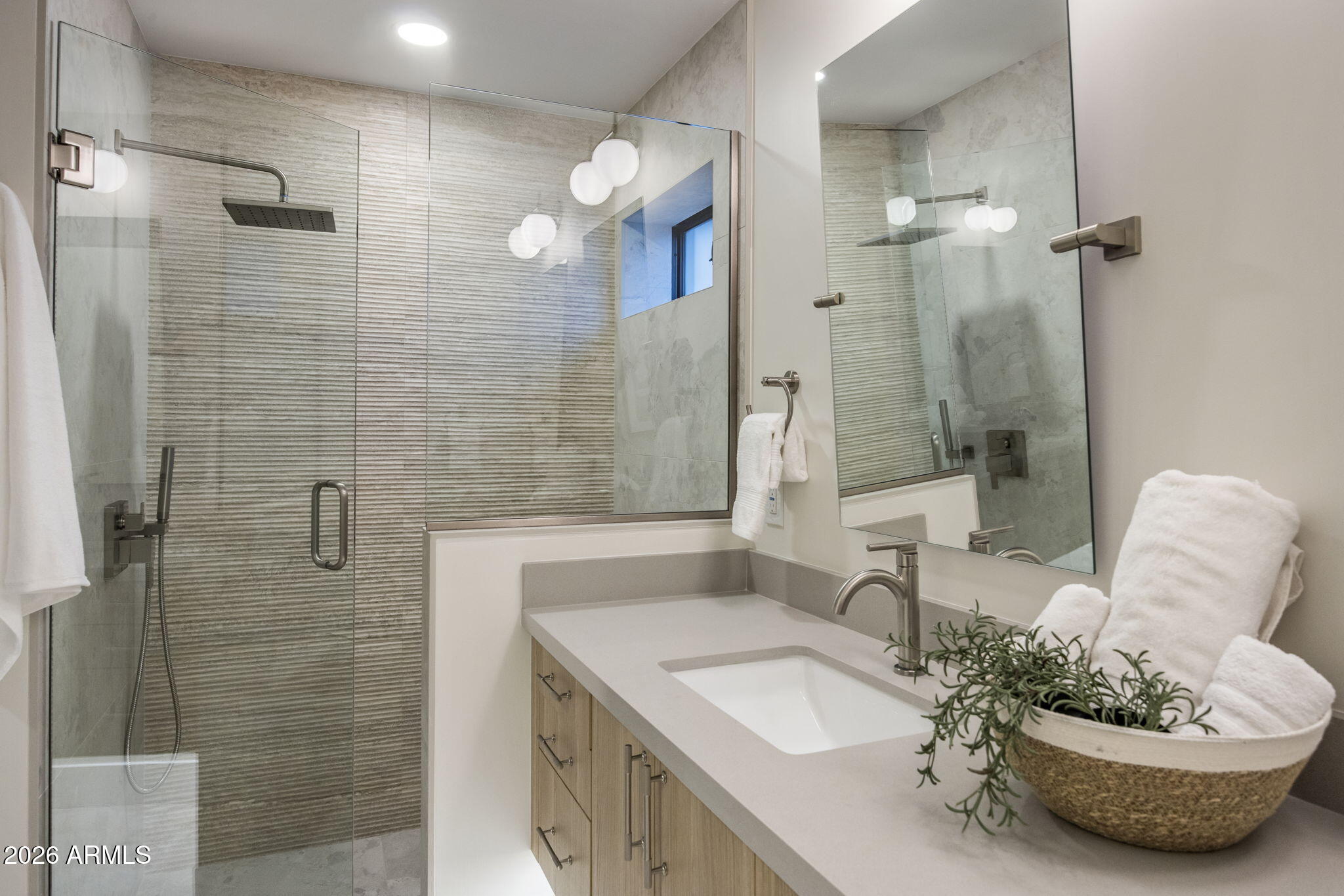 3023 North 49th Street Phoenix, AZ 85018 - Photo 17 of 32 a bathroom with a sink a toilet and shower
