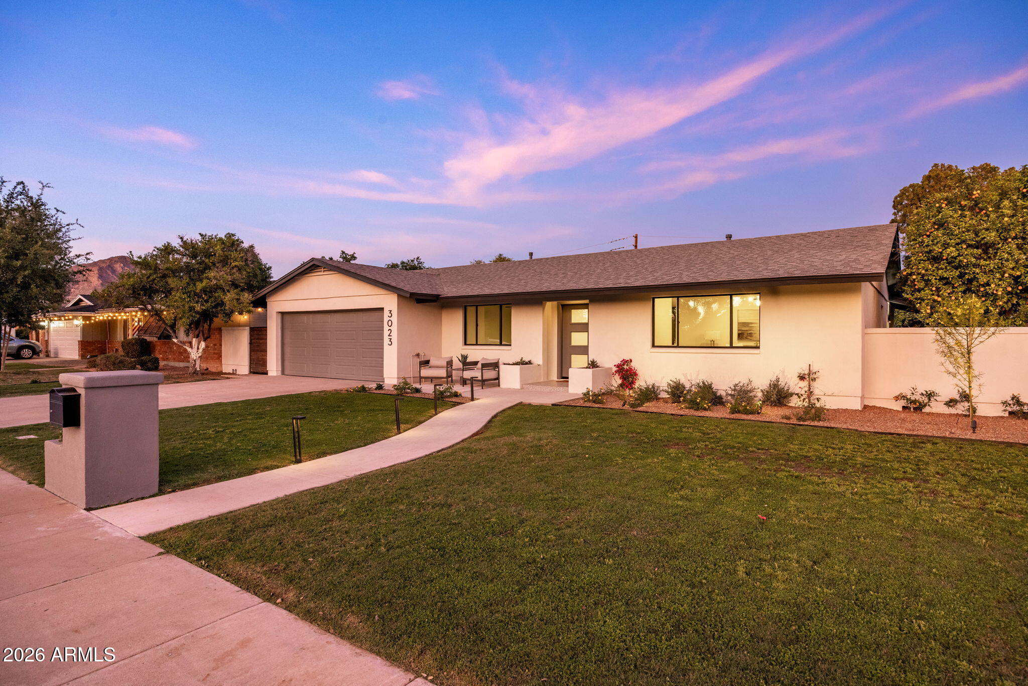 3023 North 49th Street Phoenix, AZ 85018 - Photo 2 of 32 a front view of a house with garden