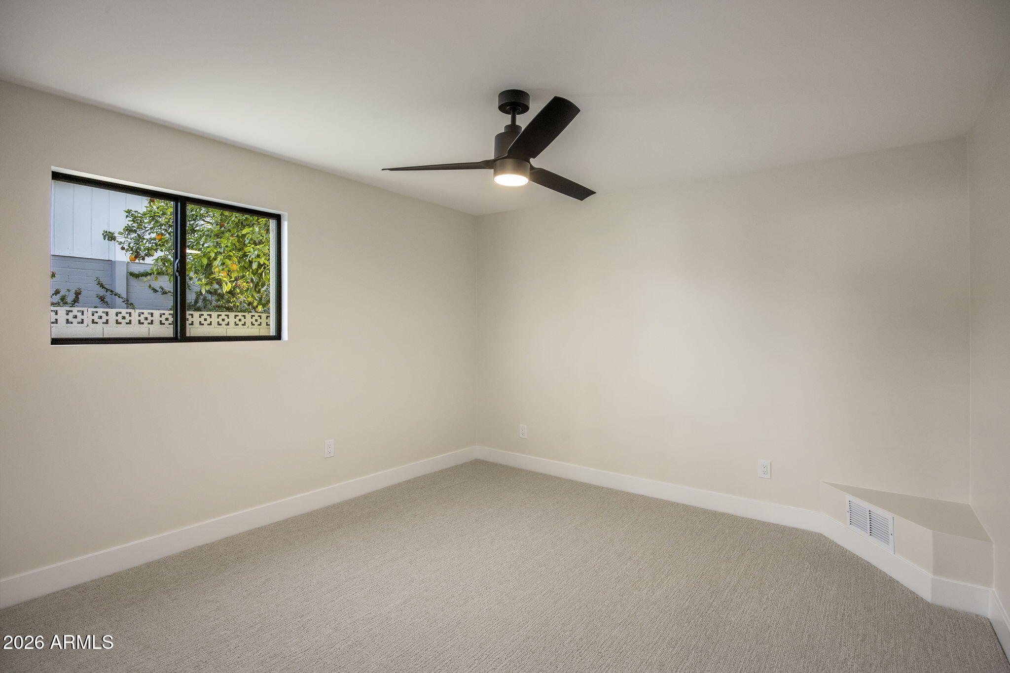 3023 North 49th Street Phoenix, AZ 85018 - Photo 21 of 32 a view of an empty room with a window