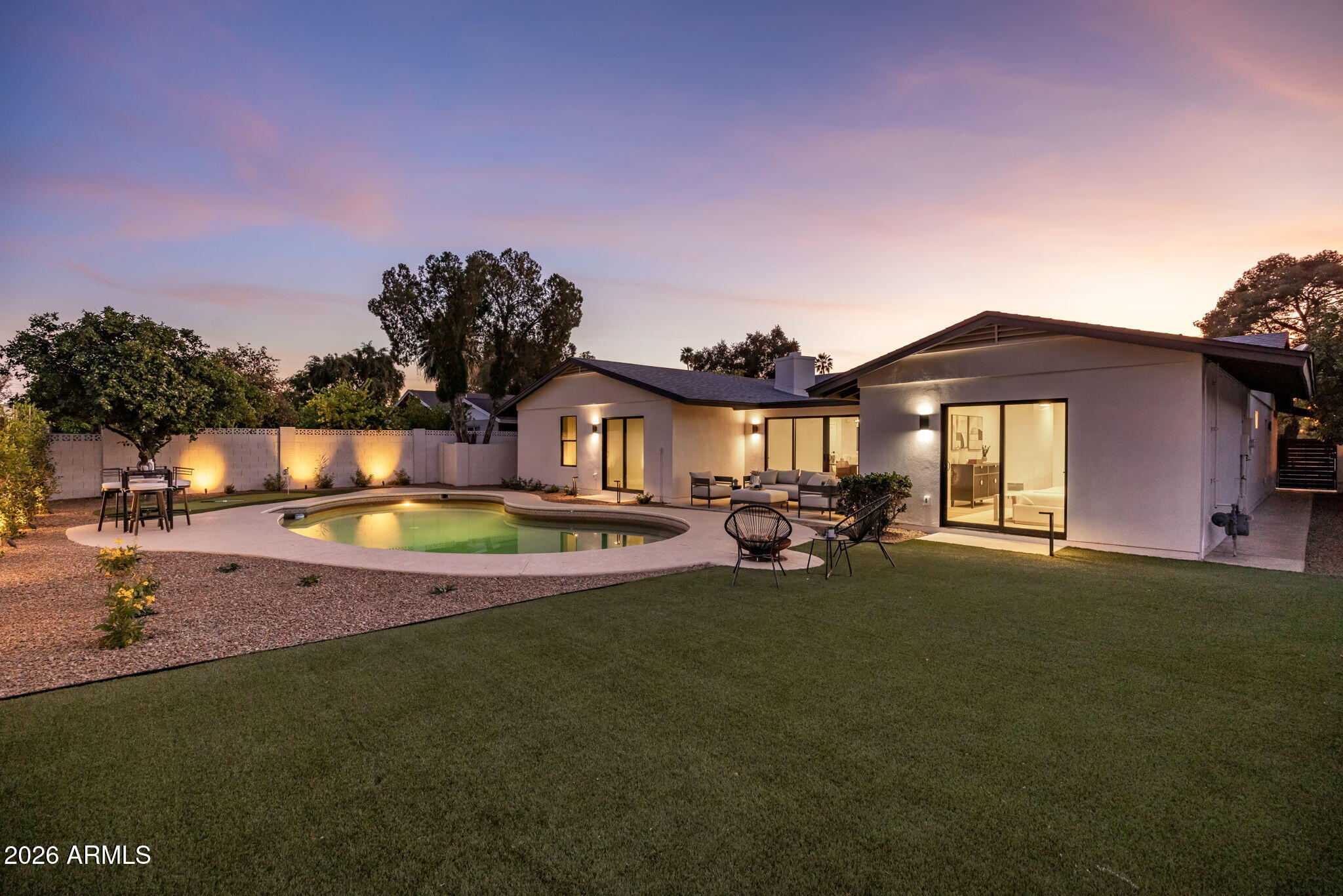 3023 North 49th Street Phoenix, AZ 85018 - Photo 28 of 32 a view of a house with swimming pool and porch