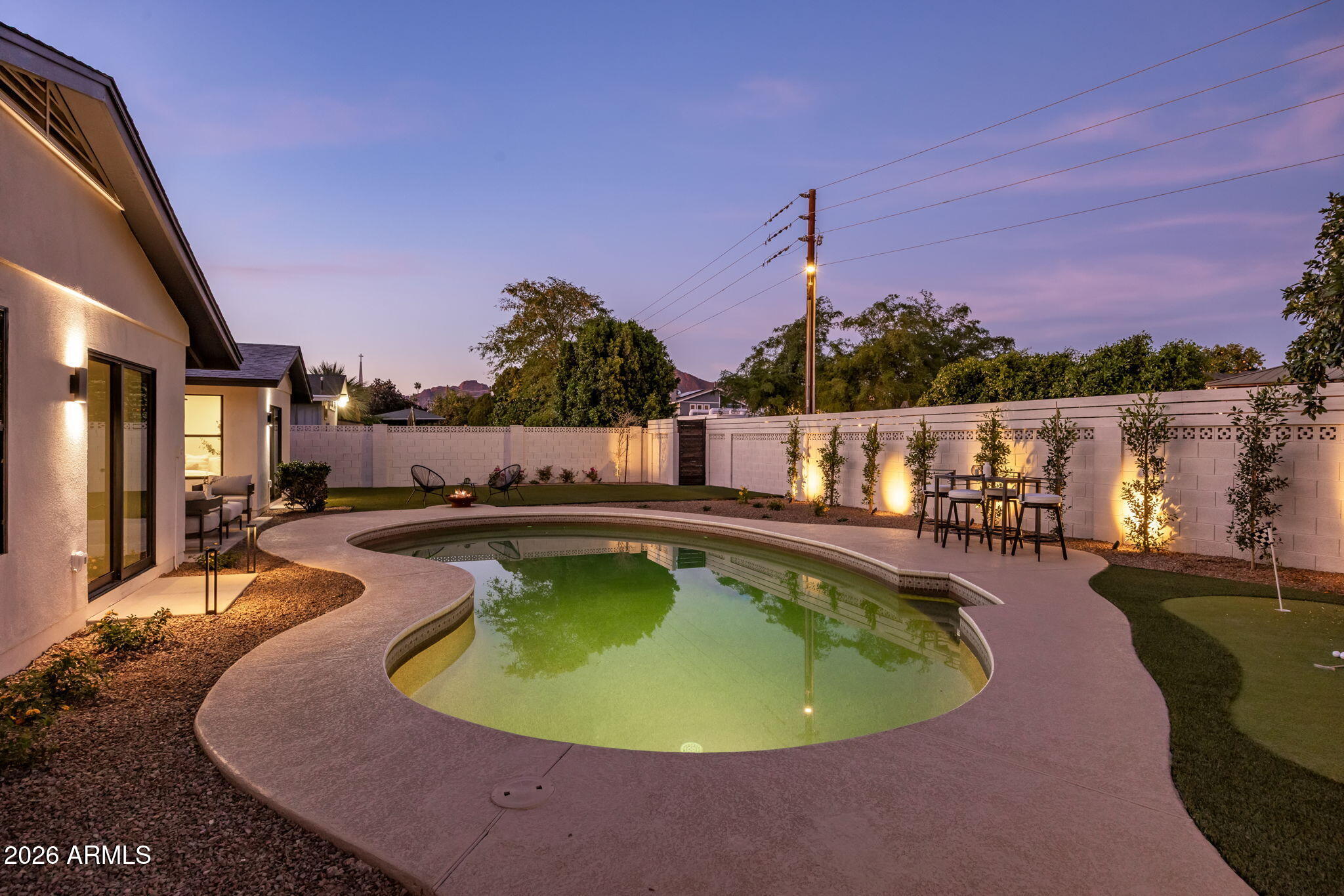 3023 North 49th Street Phoenix, AZ 85018 - Photo 29 of 32 a view of a swimming pool with a patio