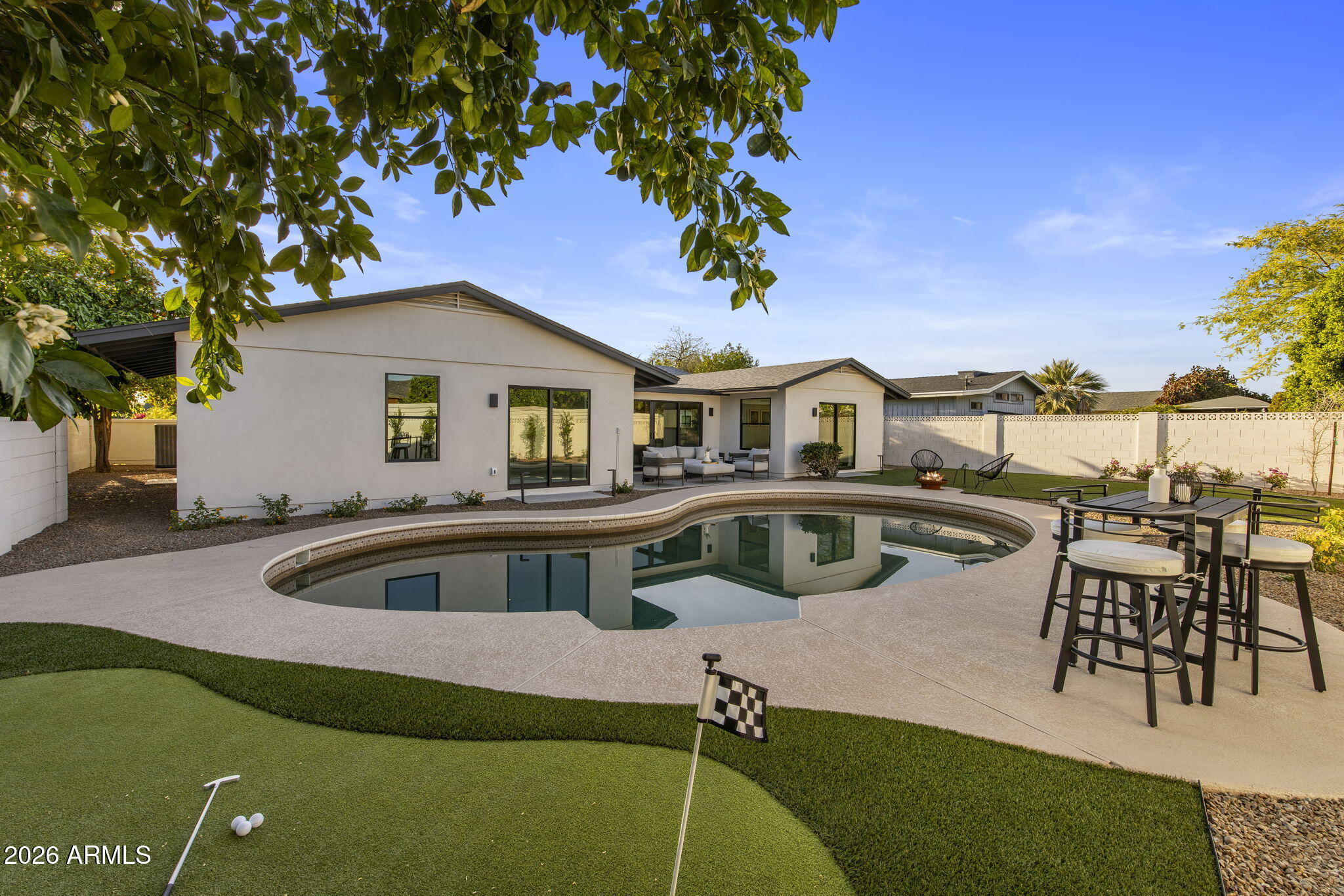 3023 North 49th Street Phoenix, AZ 85018 - Photo 31 of 32 a front view of a house with swimming pool