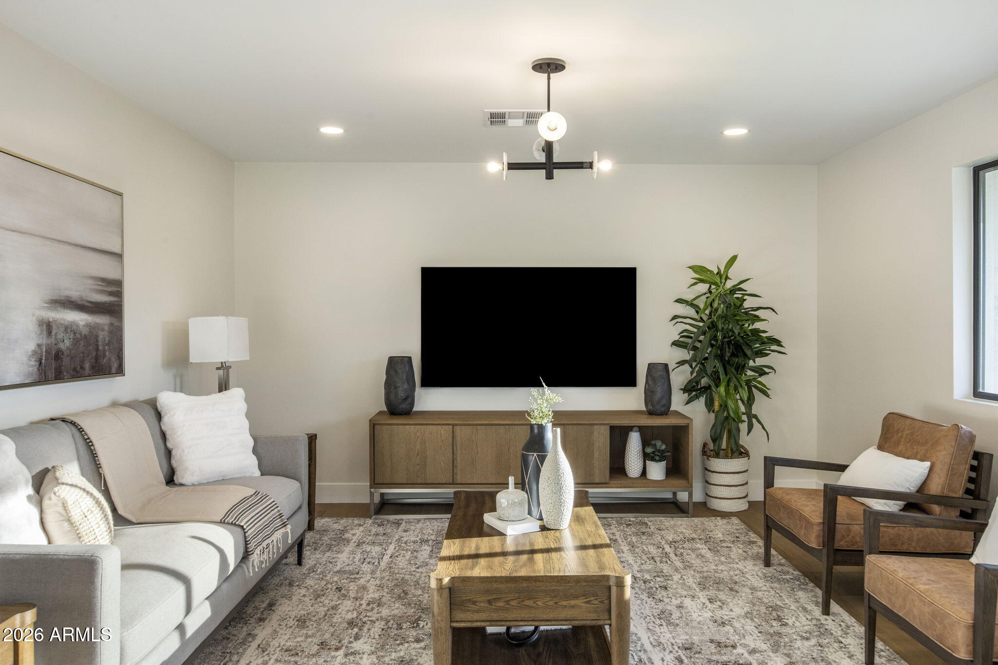 3023 North 49th Street Phoenix, AZ 85018 - Photo 5 of 32 a living room with furniture and a flat screen tv